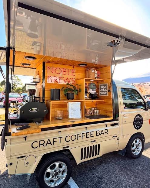 Tan Kei truck branded Noble Brews, a craft coffee bar with a wood interior